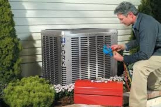 Man fixing air conditioner
